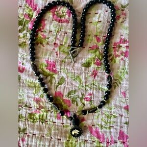Vintage black beaded necklace with Horse charm